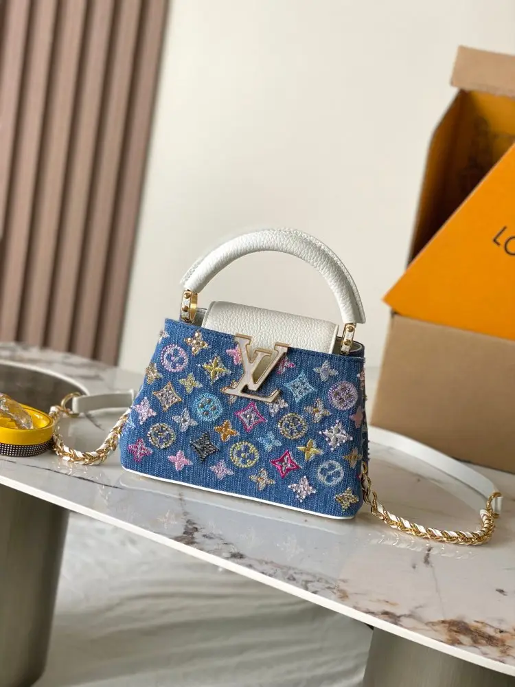 Louis Vuitton — A bag Capucines denim 21 cm