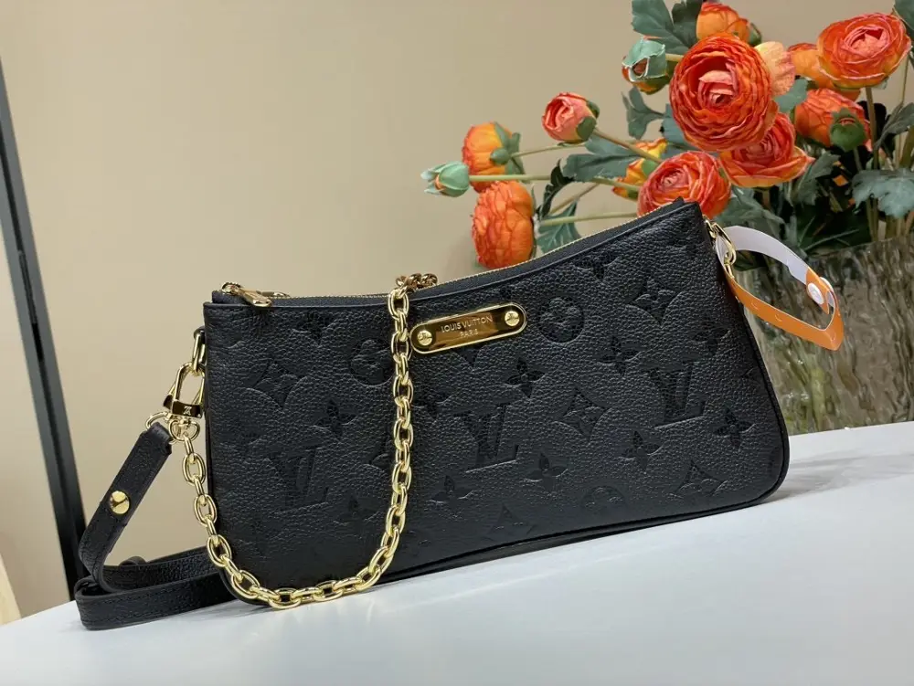 Louis Vuitton — A bag Liv Pochette on chain
