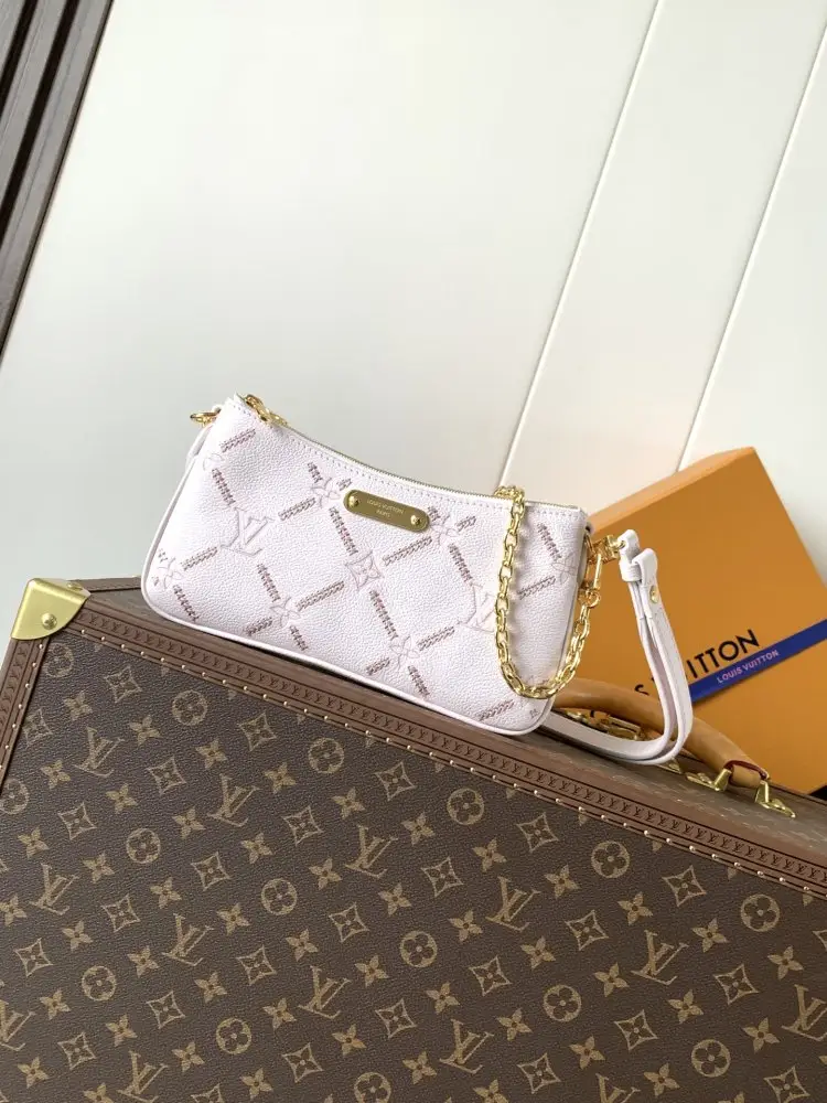 Louis Vuitton — Шкіряна сумочка Liv Monogram Empreinte 24 см
