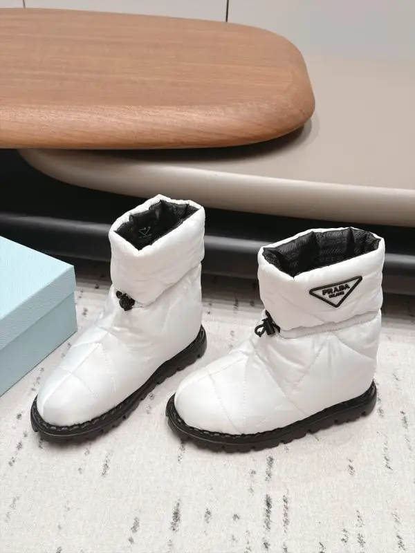 Prada — Ugg boots on feathers