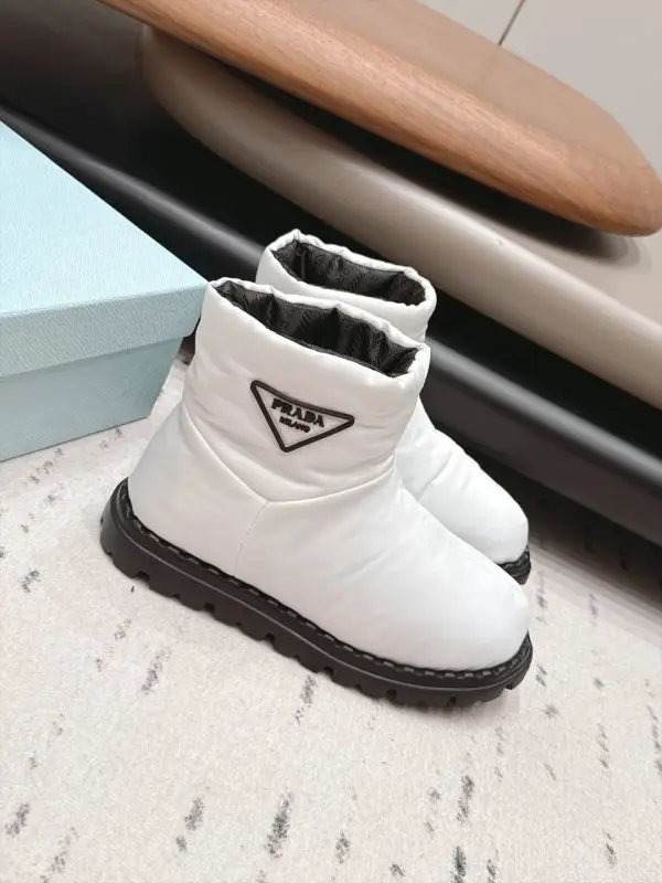 Prada — Ugg boots on feathers